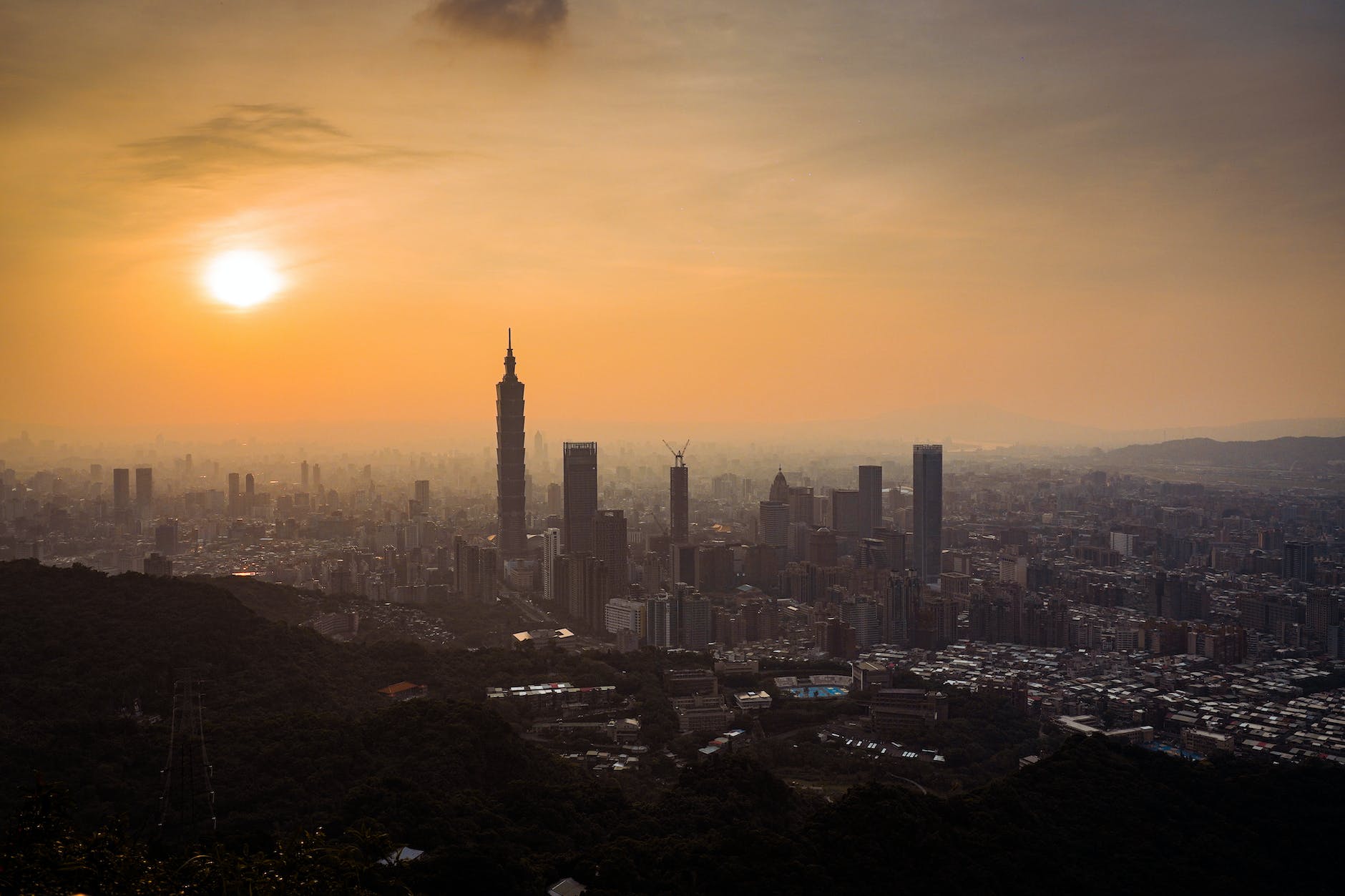 silhouette of city buildings during sunset